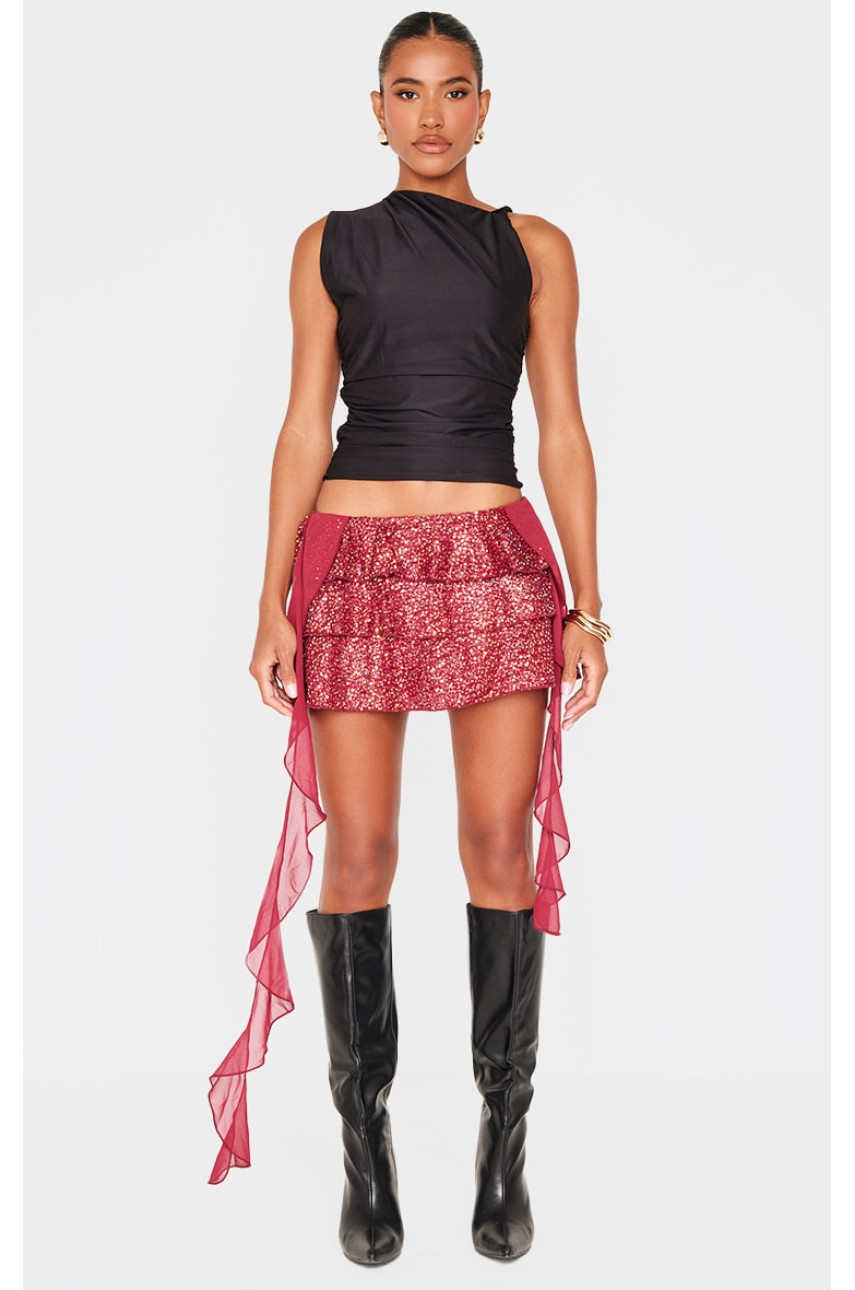 Міні-спідниця бордового кольору з оборками та паєтками