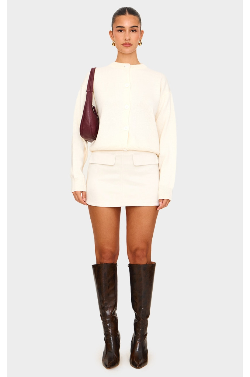 Міні-спідниця з кишеньками з кишені і штучної замші кольору екрю