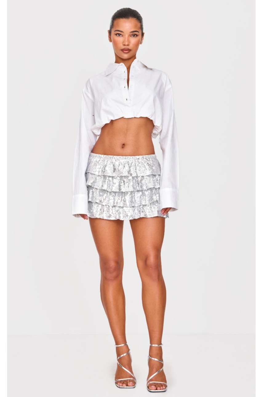 Срібляста багаторівнева міні-спідниця з оборками з паєтками