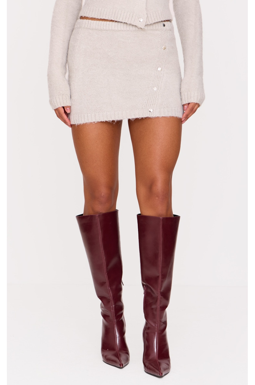 Сіра м'яка трикотажна асиметрична міні-спідниця з поппером