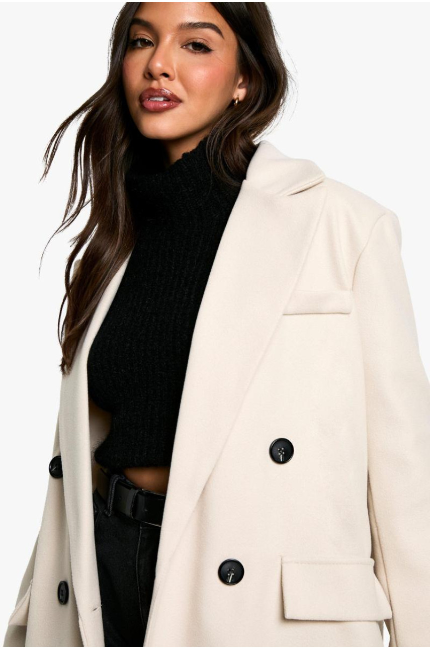 Вовняне пальто з великими манжетами