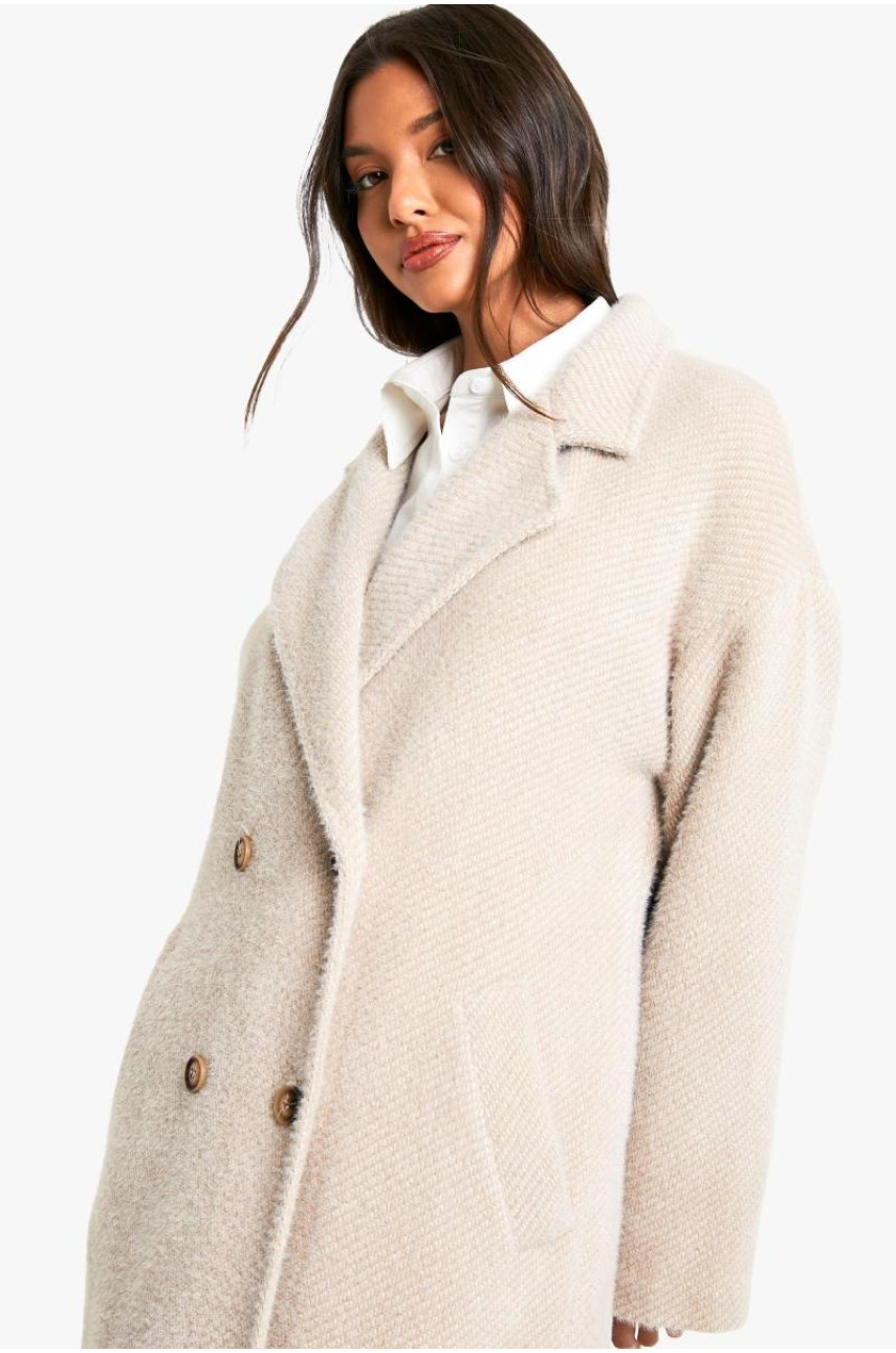 Довгобортне двобортне пальто з фактурою